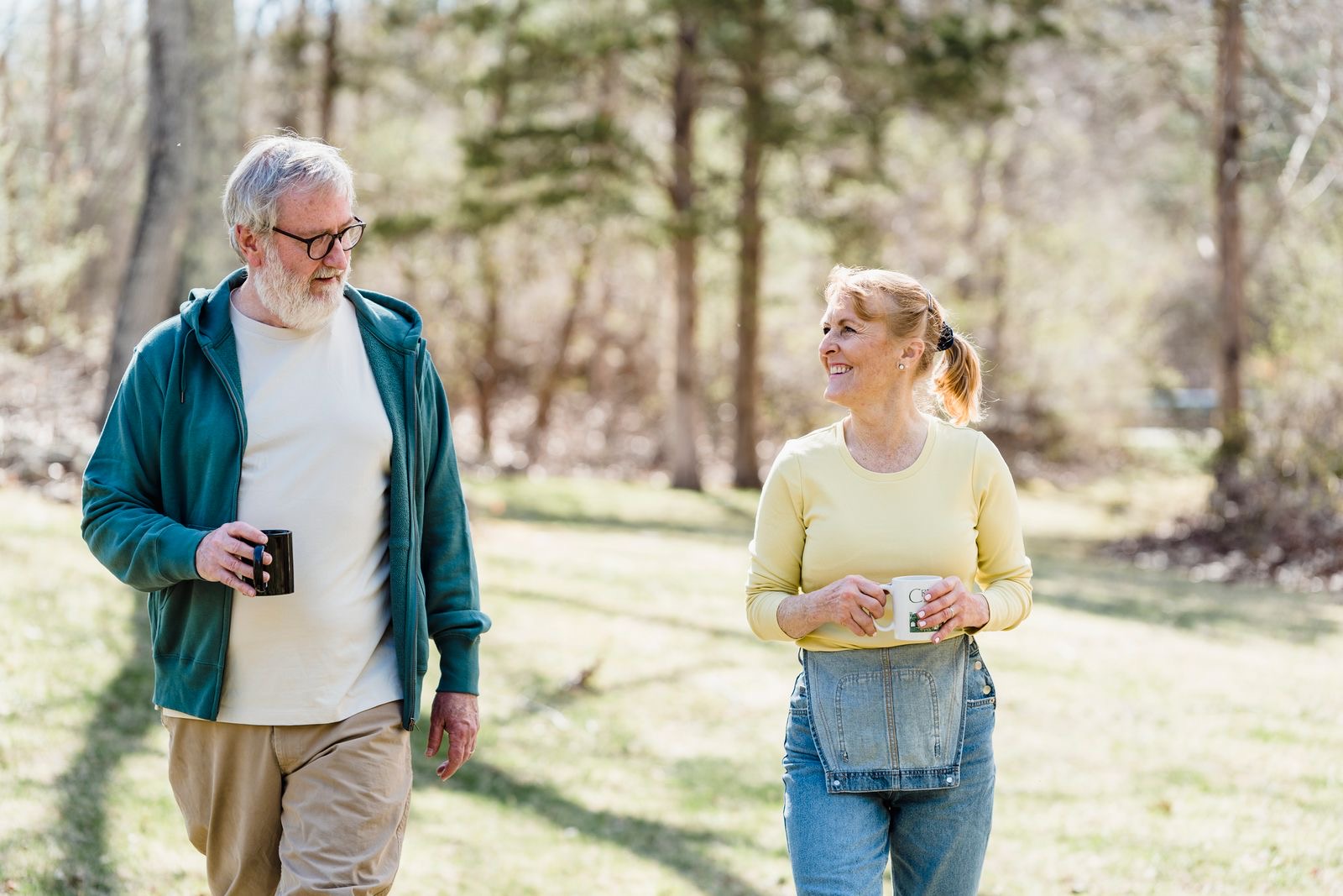 An active older couple walking outdoors, healthy and well